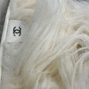 Chanel clear high heel fur boots.
